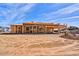 New construction of a single-story home, showcasing the framing and the initial stages of development under a clear sky at 3329 W Desert Dawn Dr, Phoenix, AZ 85083
