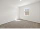Inviting bedroom with neutral carpeting and a window providing natural light at 37014 W La Paz St, Maricopa, AZ 85138