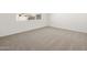 Bedroom featuring neutral carpet, white walls, and natural light at 37014 W La Paz St, Maricopa, AZ 85138
