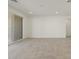 Spacious living room with tiled flooring, recessed lighting and sliding glass doors at 37014 W La Paz St, Maricopa, AZ 85138