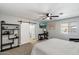 This bedroom features neutral walls, carpet, a ceiling fan, and an entertainment area at 1413 E Windsor Ave, Phoenix, AZ 85006