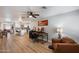 Spacious open-concept living room featuring wood floors and desk, leading to a modern kitchen at 1413 E Windsor Ave, Phoenix, AZ 85006