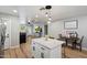 A spacious living room flows into an eat-in kitchen with wood floors and an entertainment area at 1413 E Windsor Ave, Phoenix, AZ 85006