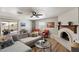 Relaxing living room features a fireplace, wood floors, a ceiling fan, and comfortable seating at 1413 E Windsor Ave, Phoenix, AZ 85006
