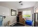 Bright and airy room with a window, boxes, cat tree, and storage, creating a flexible space at 1413 E Windsor Ave, Phoenix, AZ 85006