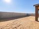 Spacious backyard with a block wall at 37405 W San Clemente St, Maricopa, AZ 85138