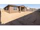 Large backyard with sandy ground and block wall at 37405 W San Clemente St, Maricopa, AZ 85138