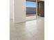 View of backyard through sliding glass doors at 37405 W San Clemente St, Maricopa, AZ 85138