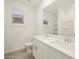 Bathroom with double vanity and tiled flooring at 37405 W San Clemente St, Maricopa, AZ 85138
