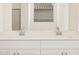 Bathroom with double vanity and a large mirror at 37405 W San Clemente St, Maricopa, AZ 85138