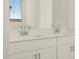 Bathroom featuring a double vanity with chrome fixtures at 37405 W San Clemente St, Maricopa, AZ 85138