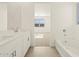 Bathroom boasting double vanity and a bathtub at 37405 W San Clemente St, Maricopa, AZ 85138