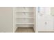 Bathroom with shelving and double vanity at 37405 W San Clemente St, Maricopa, AZ 85138