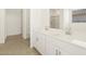 Double vanity bathroom with modern fixtures and tile flooring at 37405 W San Clemente St, Maricopa, AZ 85138