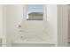 Bathroom featuring a large soaking tub at 37405 W San Clemente St, Maricopa, AZ 85138