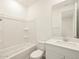 Clean bathroom with a bathtub, toilet, and vanity at 37405 W San Clemente St, Maricopa, AZ 85138