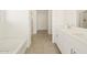 Bathroom with double vanity, soaking tub, and shower at 37405 W San Clemente St, Maricopa, AZ 85138