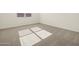 Well-lit bedroom with neutral carpeting and window blinds at 37405 W San Clemente St, Maricopa, AZ 85138