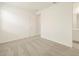 Spacious bedroom with neutral carpeting and an ensuite bathroom at 37405 W San Clemente St, Maricopa, AZ 85138
