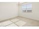 Bright dining room with large window and chandelier at 37405 W San Clemente St, Maricopa, AZ 85138