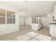 Bright kitchen with island, stainless steel appliances, and white cabinets at 37405 W San Clemente St, Maricopa, AZ 85138