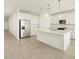 Modern kitchen with stainless steel appliances and an island at 37405 W San Clemente St, Maricopa, AZ 85138