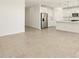 Open concept living area with view into kitchen and hallway at 37405 W San Clemente St, Maricopa, AZ 85138
