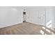 Bedroom with neutral carpet, a closet, and white walls providing a bright space at 10026 W Lancaster Dr, Sun City, AZ 85351