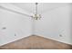 Bright dining area featuring tile flooring and a charming chandelier at 10026 W Lancaster Dr, Sun City, AZ 85351