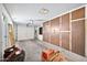Functional garage space with overhead door, built-in storage cabinets, and plenty of room for vehicles at 10026 W Lancaster Dr, Sun City, AZ 85351