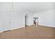 Bright, open living space with neutral tile flooring and fresh white paint at 10026 W Lancaster Dr, Sun City, AZ 85351