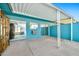 Back patio offering shade and easy access to indoor living spaces through sliding glass doors at 10026 W Lancaster Dr, Sun City, AZ 85351