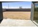 View of the expansive backyard, providing a blank canvas for landscaping and outdoor enjoyment at 46963 W Coe St, Maricopa, AZ 85139