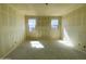 Bedroom with two windows that provide natural light, freshly plastered walls and ceiling at 46963 W Coe St, Maricopa, AZ 85139