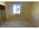 Bedroom with a window offering natural light and a view of the outdoors at 46963 W Coe St, Maricopa, AZ 85139