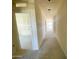 Bright hallway with smooth walls and high ceilings, showcasing modern construction at 46963 W Coe St, Maricopa, AZ 85139