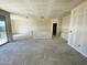 Spacious living room showcasing smooth walls and ample natural light from sliding glass door at 46963 W Coe St, Maricopa, AZ 85139