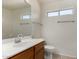 This bathroom has a large mirror, a wood cabinet, and a window for natural light at 1926 E Siesta Ln, Phoenix, AZ 85024