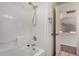 This bathroom features white tile in the shower and a new shower head at 1926 E Siesta Ln, Phoenix, AZ 85024