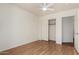 This bedroom has wood-style floors, a ceiling fan, and a closet with sliding doors at 1926 E Siesta Ln, Phoenix, AZ 85024