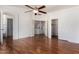 Large bedroom with hardwood floors featuring doors to a walk-in closet and hallway at 1926 E Siesta Ln, Phoenix, AZ 85024