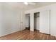 Bedroom with light wood floors, a closet and sliding doors for easy access at 1926 E Siesta Ln, Phoenix, AZ 85024