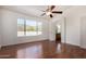 Bright bedroom with hardwood floors, ceiling fan and a mountain view at 1926 E Siesta Ln, Phoenix, AZ 85024