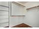 Walk-in closet with shelves and hanging rods providing ample storage space at 1926 E Siesta Ln, Phoenix, AZ 85024