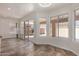 Open living space with tile floors, sliding door, and many windows for natural light at 1926 E Siesta Ln, Phoenix, AZ 85024