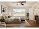 Inviting main bedroom with a large window, ceiling fan and ensuite bathroom at 1926 E Siesta Ln, Phoenix, AZ 85024