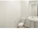 Clean bathroom with toilet and pedestal sink at 4036 S 177Th Ave, Goodyear, AZ 85338