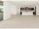 Open concept living area with kitchen and access to patio at 4036 S 177Th Ave, Goodyear, AZ 85338