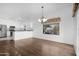 Bright dining area connects to the kitchen with granite countertops and stainless steel appliances at 45075 W Gavilan Dr, Maricopa, AZ 85139