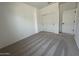 Cozy bedroom with plush carpet, closet, and ample natural light, creating a peaceful retreat at 46963 W Coe St, Maricopa, AZ 85139